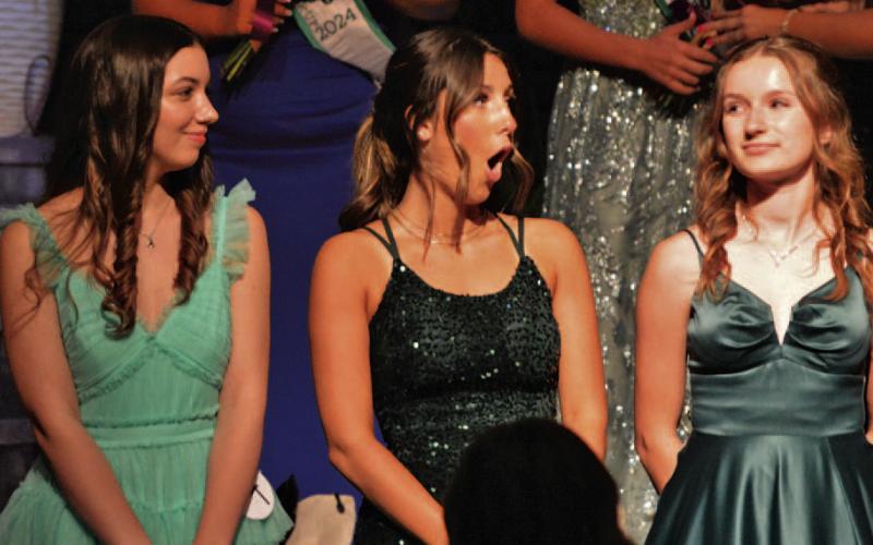 At center, contestant Lily Fryer gasps in disbelief as she is named 2024 Miss Spring Ho on Monday evening. ERICK MITCHELL | DISPATCH RECORD