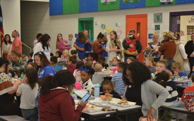 Hundreds of family members visited their students at Taylor Creek Elementary School for Friday’s Thanksgiving feast during lunchtime. erick mitchell | dispatch record