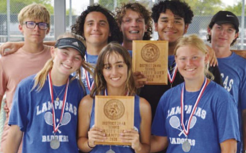 HUNTER KING | DISPATCH RECORD Tennis players show off their plaques from the district tournament.