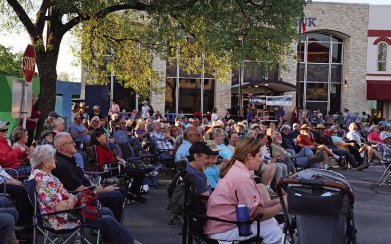 Amid the warm glow of a setting sun, a diverse array of people dressed in an eclectic mix of cowboy hats, denim jackets, boots and vintage dresses are charmed by the rhythmic melodies of Bob Wills’ Texas Playboys. This western swing band played for the Pre-Eclipse Party held Sunday at the courthouse square. JOYCESARAH MCCABE | DISPATCH RECORD