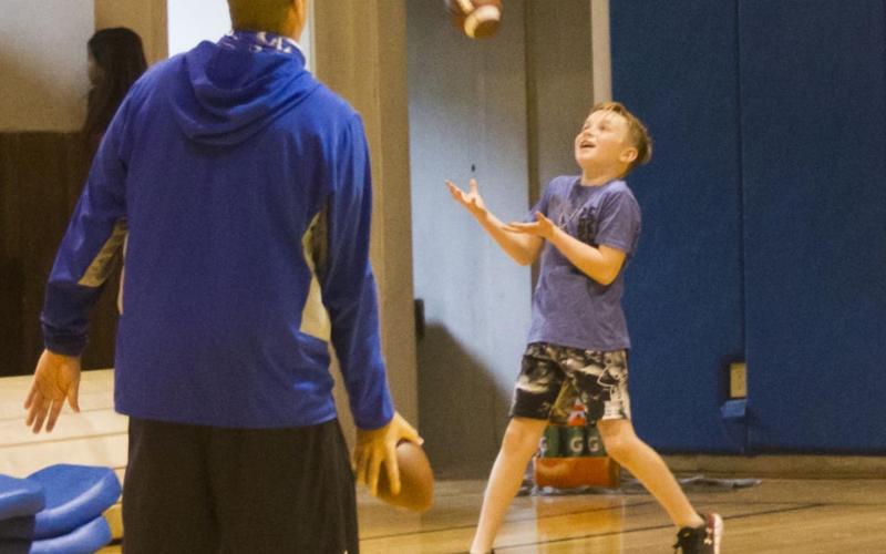 Badger coaching staff leads youth football camp
