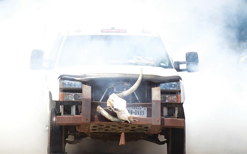 Smoke clouds around a truck during the burnout event of a previous year’s Sulphur Creek Car Cruise. file photo
