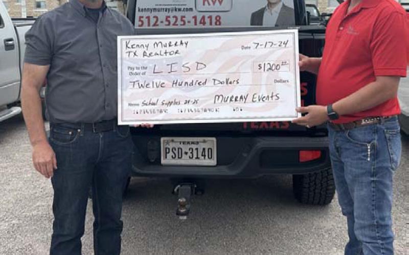 courtesy photo At left, Lampasas ISD Superintendent Dr. Chane Rascoe and Kenny Murray hold a big donation check worth $1,200. The money, which comes from the Third Annual KM Scramble held in June, will go toward school supplies.