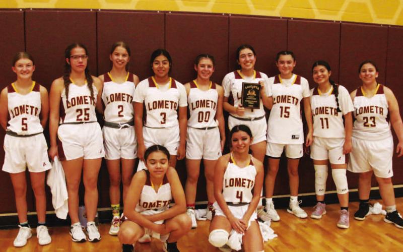 The Lady Hornets pose with their third-place plaque after the home tournament. COURTESY PHOTO | FRANK REYES III