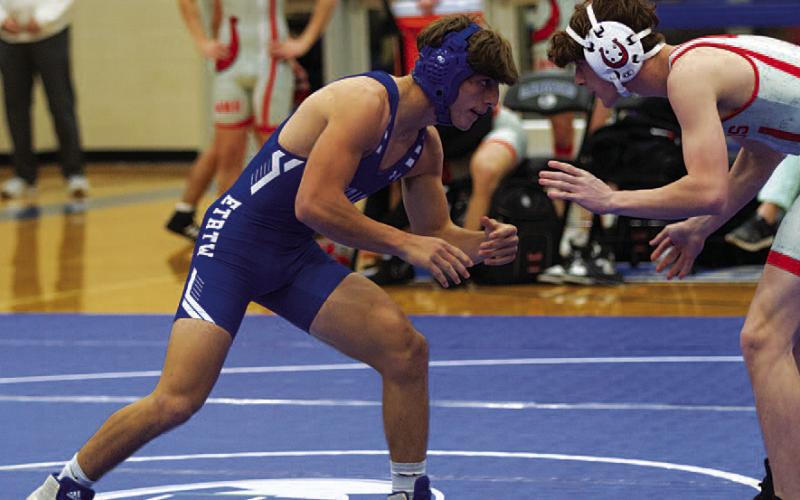 Cole Warren sizes up his opponent during last Wednesday’s wrestling meet. HUNTER KING | DISPATCH RECORD