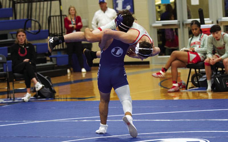 Daemian Rivas goes for a slam against Lake Belton. HUNTER KING | DISPATCH RECORD