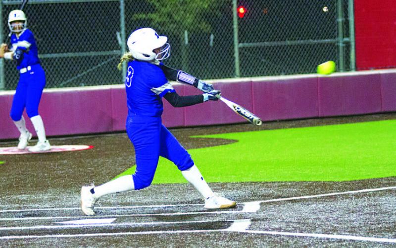 HUNTER KING | DISPATCH RECORD Brady Burton swings and delivers one of her two hits during Tuesday’s game.