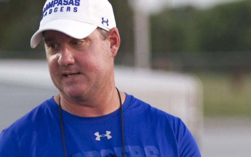 Head Coach Troy Rogers speak to his team last week after the Badgers’ second scrimmage, which was against Navasota. Rogers is a former Badger quarterback and is in his sixth year in charge of the Lampasas program. HUNTER KING | DISPATCH RECORD