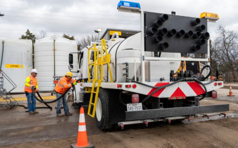 Highway crew members fill trucks with a brine solution to pretreat roadways. The brine slows the process of ice and snow bonding with the pavement. courtesy photo | texas department of transportation
