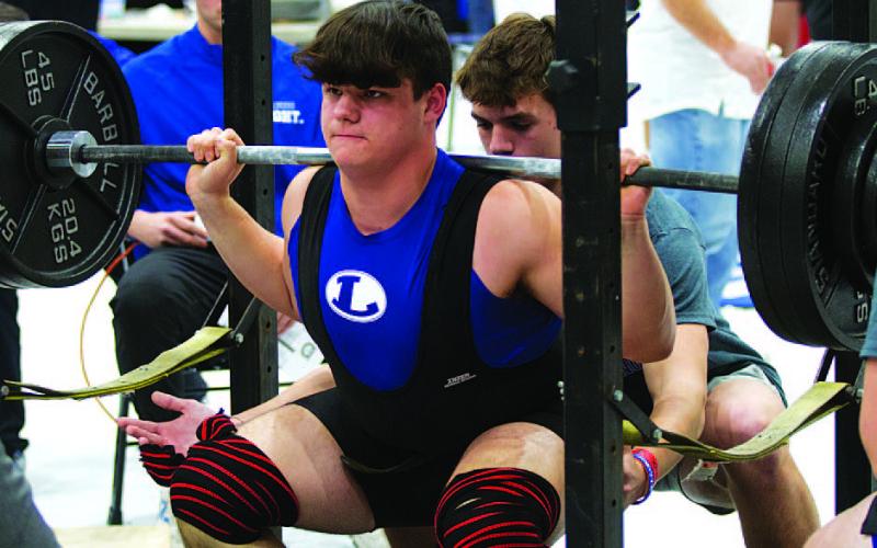 Bodhi Westra lifts during the squat portion of the Badgers’ home powerlifting meet last week. HUNTER KING | DISPATCH RECORD