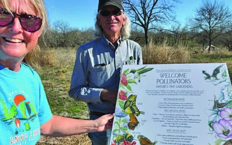 Cooper Spring Nature Park Foundation board members Barbara Adams and Harrell Clary helped install the five educational signs at the nature park on Jan. 3 COURTESY PHOTO