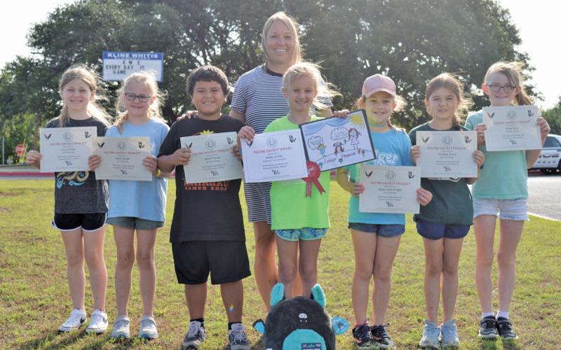Erick Mitchell | dispatch record Kline Whitis Elementary students acknowledged for their participation in the annual Rabies Awareness &amp;amp; Prevention Poster Contest include, from left, Ava Latham, Keira Sladek, Rhett Perez, Arden Achèe, Kylee Jean Kruppa, Caroline Jones and Kylee Davis. Assistant Principal Tracie Chapa stands behind the group.