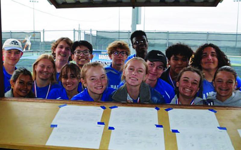 The Lampasas tennis team smiles for a photo at their tournament last Friday. COURTESY PHOTO | KENNETH PEISER