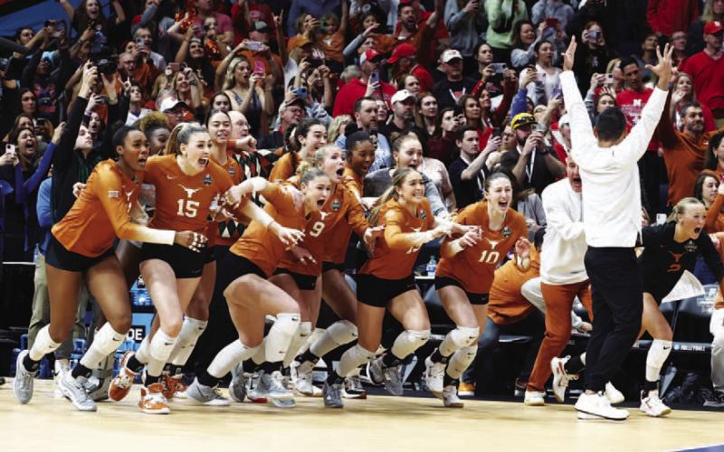 The Texas volleyball team storms the court after winning the national championship. COURTESY PHOTO | TEXAS ATHLETICS