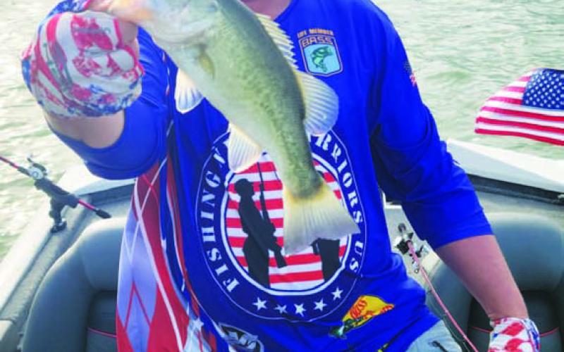 COURTESY PHOTO | ERIC METCALF Eric Metcalf holds a largemouth bass he caught.