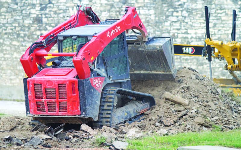 Work crews have been at the former jail lot since Wednesday morning, removing the old base and preparing the property for a chip-seal pavement that will be applied to create a downtown parking lot on East Fourth Street. HUNTER KING | DISPATCH RECORD