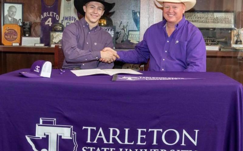 Kempner-area bull rider Riggen Hughes, left, signed with Tarleton State University’s rodeo program. He is shown with coach Mark Eakin. COURTESY PHOTO