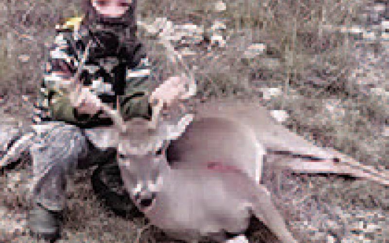 Eight-year-old Gauge Downing killed this buck with his crossbow in Lampasas County. COURTESY PHOTO