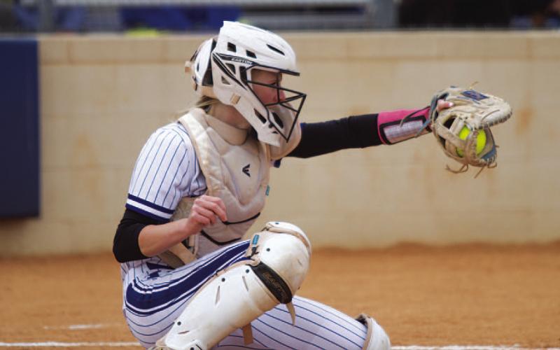 Kali Hunter frames a pitch during the Tuesday win over the Lago Vista Lady Vikings. HUNTER KING | DISPATCH RECORD