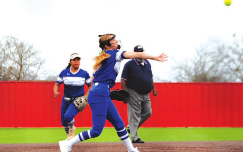 Hadley Oncken makes a throw across from third to first to record an out against the Lady Eagles last Thursday. HUNTER KING | DISPATCH RECORD