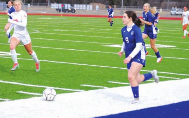Bella Lindsey dribbles down the left wing against the Lake Belton Lady Broncos. HUNTER KING | DISPATCH RECORD