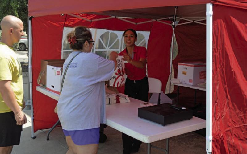 Chick-fil-A’s mobile service assists a customer during its first day of operations in Lampasas. ERICK MITCHELL | DISPATCH RECORD