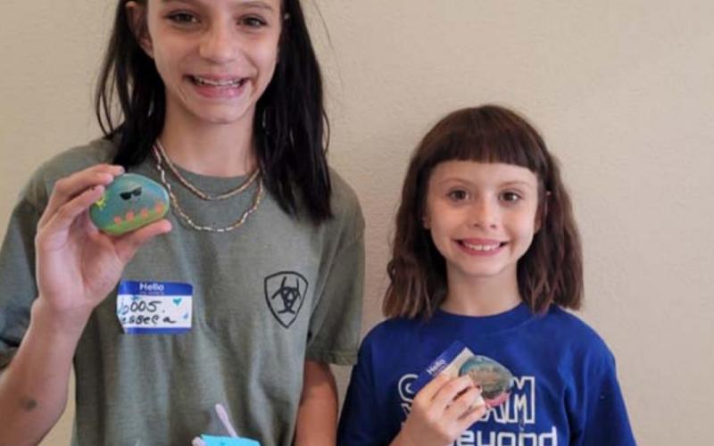 Showing their kindness rocks are Jesseca Mahoney and Kayleigh Mahoney. COURTESY PHOTO