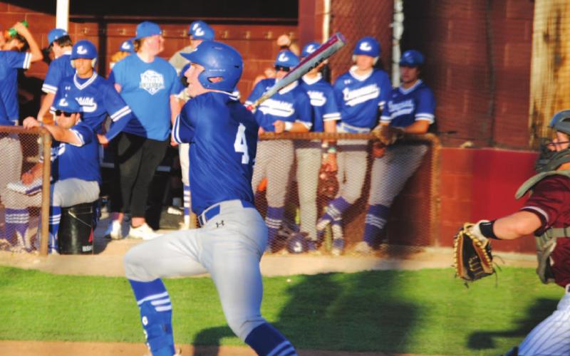 Rawlin Smith follows through on a swing where he sent a single into left field for his first of three hits on Tuesday night. HUNTER KING | DISPATCH RECORD