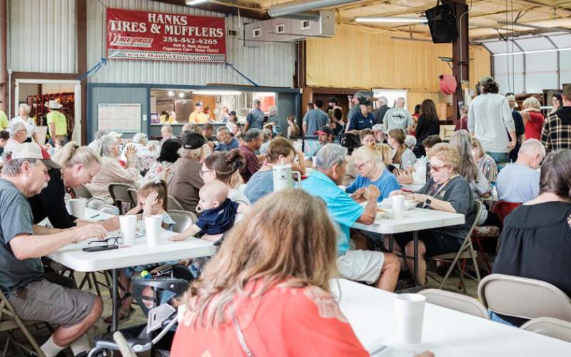 The annual fundraiser event attracts a large crowd of community members with barbecue and unique auction items. The fundraiser accounts for a large part of the department’s revenue each year. File Photo