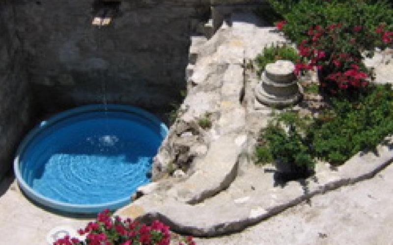 Seen here is the historic underground spring behind the 1850s-era house the Solomons bought in 1988. This also illustrates Pablo’s outdoor design style. COURTESY PHOTO