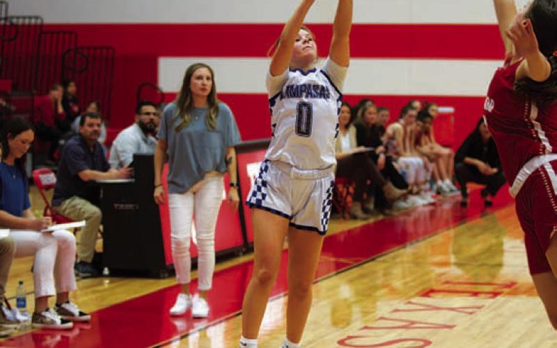 HUNTER KING | DISPATCH RECORD Addison Borchardt releases a three over an attempted block.