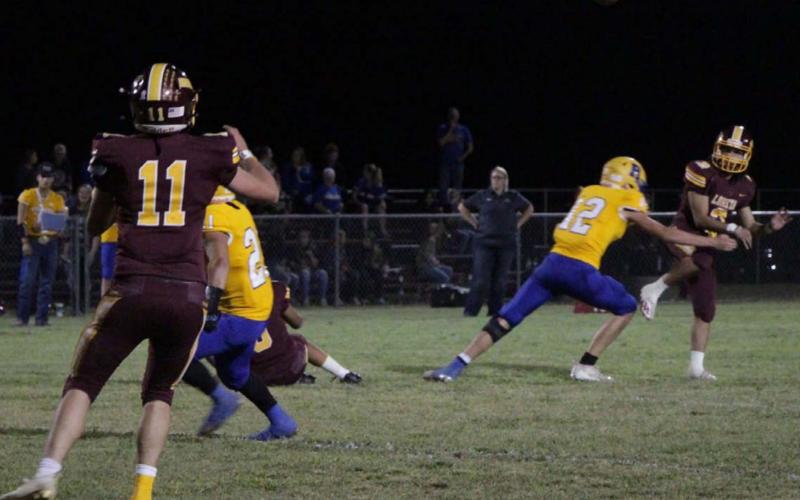 Alonso Caso throws a pass down field looking for D.J. Smart during the Hornets’ 69-20 mercy rule win over Rochelle last Friday night. JESSICA MALDONADO | DISPATCH RECORD