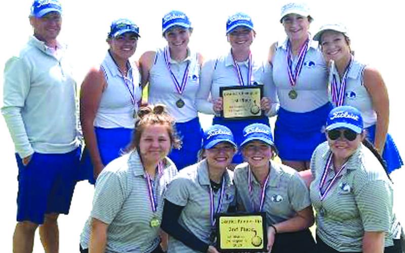 COURTESY PHOTO | JUSTIN SCHULZE The two Lady Badger golf teams pose with their district champion and district runner-up trophies after their success this week.