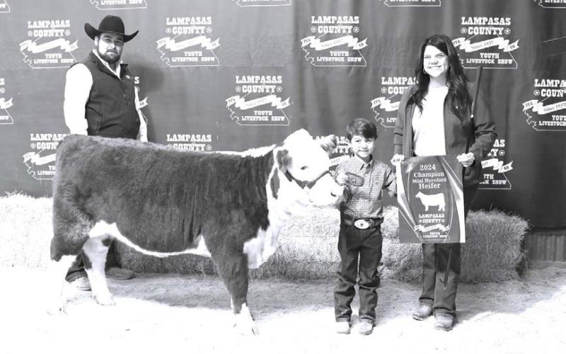 JOYCESARAH MCCABE | DISPATCH RECORD This year’s peewee showman in the cattle division was Henry Schneider, pictured with his mother, Lacey Schneider.