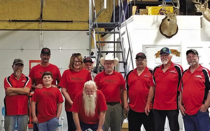 The Redliner group that attended the Winter Blast included, from left to right, Mark Mortensen, Scott Carrigan and grandson Jace Wenger, Carol P. and her husband Danny Britton, Alan Harry (in background), Jim Ulbrich, Dave Arens, host Walt Birchfield and Larry Westphal. COURTESY PHOTO