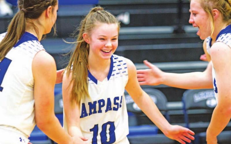 Addison Borchard high-fives Rebekah Pearce and Aspen Wheeler before a contest early in the season. The freshman is the primary ball handler for the Lady Badgers. HUNTER KING | DISPATCH RECORD
