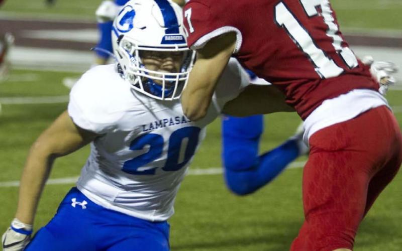 Levi Rivera wraps up a Fredericksburg receiver during the Badgers’ 52-42 win last week. HUNTER KING | DISPATCH RECORD