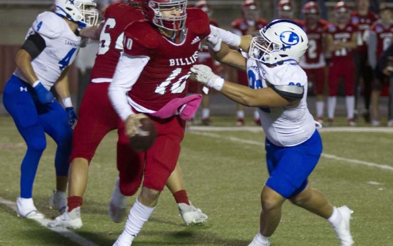 Josh Carter puts pressure on Fredericksburg quarterback Cole Immel, which he did most of the night, with nine total pressures in the game. HUNTER KING | DISPATCH RECORD