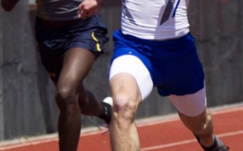 Cade White, right, sprints to first place in the 100-meter dash on Thursday in Brownwood. JEFF LOWE | DISPATCH RECORD