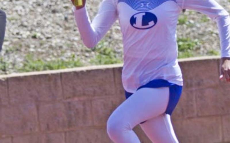 Arielle Aguirre competes in the 4x200-meter relay. JEFF LOWE | DISPATCH RECORD