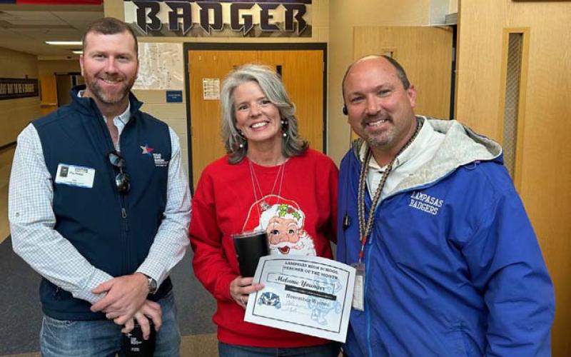 For November, Melanie Younger was named Teacher of the Month at Lampasas High School, where she is a math instructor and special education teacher. On hand to congratulate Younger are Clay Phillips, at left, of Texas Farm Bureau Insurance, and Assistant Principal Ryan Race, who said Younger “does a fabulous job building relationships and promoting learning with some of our students that struggle.” COURTESY PHOTO