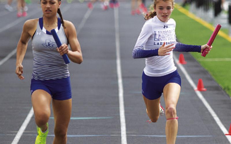 Hailey Palmer, at right, runs the final leg of the 4x100-meter relay at the area track meet. HUNTER KING | DISPATCH RECORD