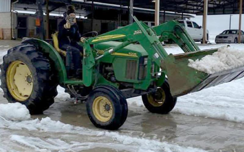 Meagan Cline plows snow last winter during a week of extra duty at her job in Bryan. COURTESY PHOTO