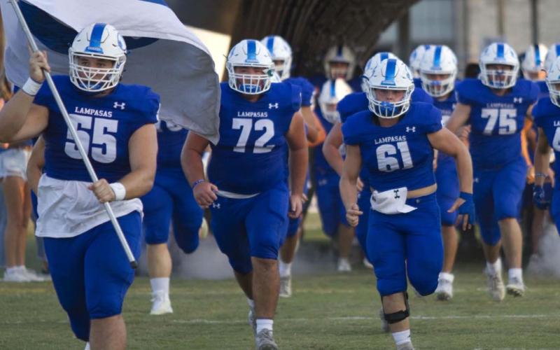 The Badger football team comes running out of the tunnel prior to Lampasas’ matchup against Elgin at home last Friday. Next up for the Badgers is a game at Wimberley. HUNTER KING | DISPATCH RECORD