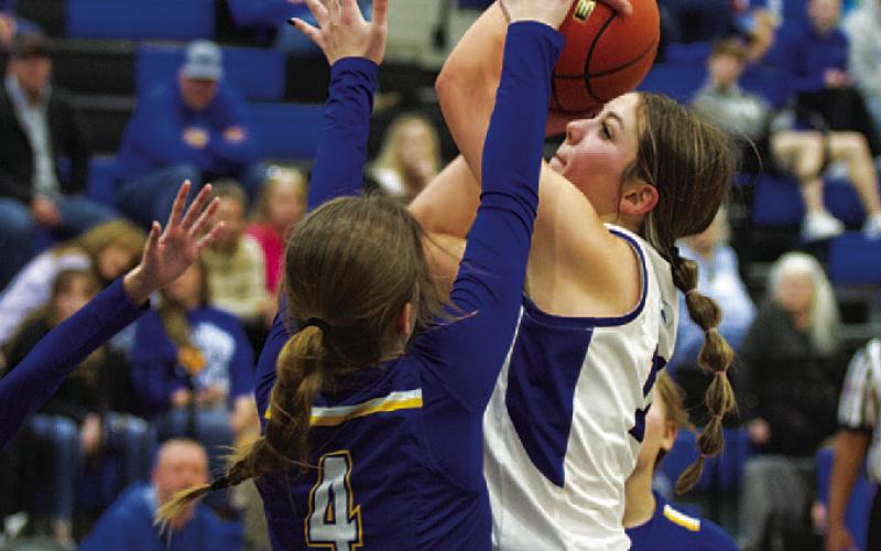 Mia Mulcahy shoots over a Lago Vista defender. The freshman continues to improve this season. HUNTER KING | DISPATCH RECORD