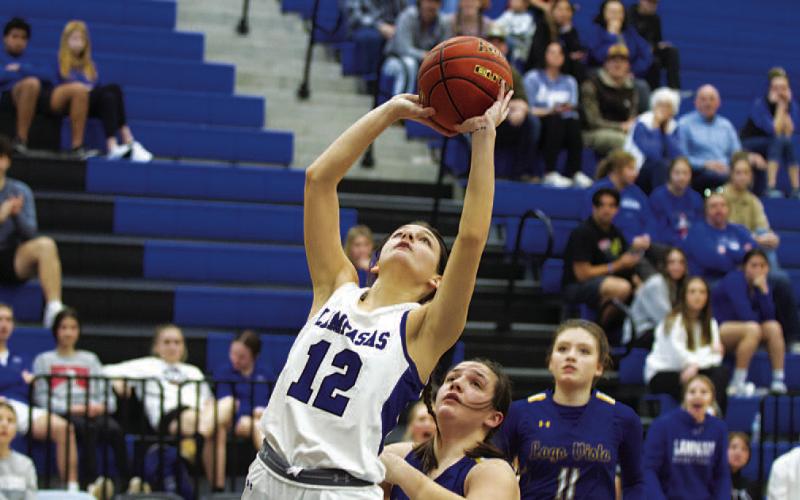 Kalyn Mulcahy rises up for two points in the district opener. HUNTER KING | DISPATCH RECORD
