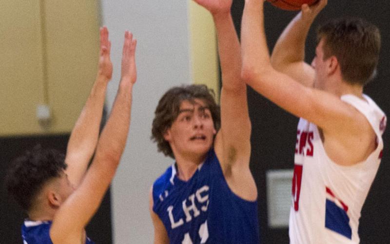 Landon Mulcahy (12) and Anthony Ortiz (1) defend the perimeter on Tuesday. The Badgers did not allow a single three-pointer by Graham in the 77-68 bi-district victory in Brownwood. JEFF LOWE | DISPATCH RECORD