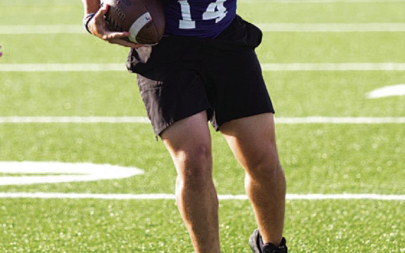 K.J. Reed makes a juke move during 7-on-7. HUNTER KING | DISPATCH RECORD
