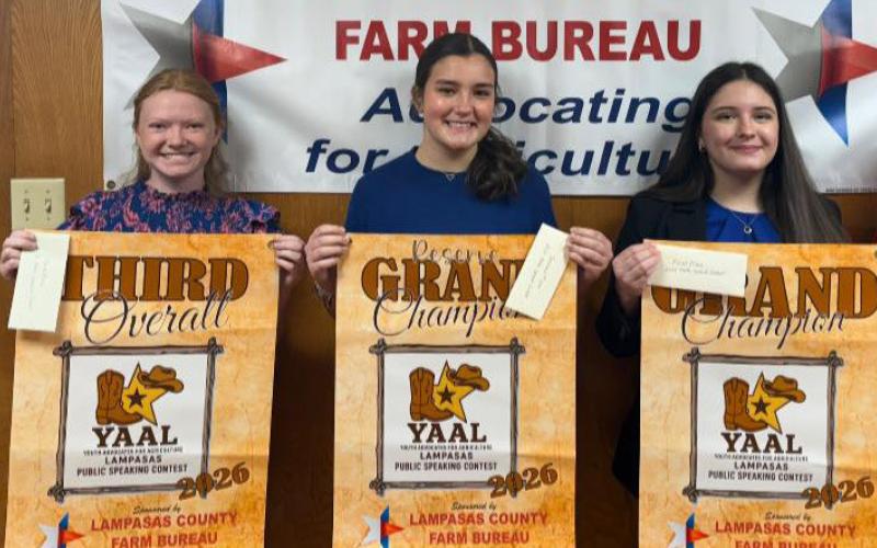 From left, Selie Hodge, Leah Walker and Bailey Gutierrez show off the banners and cash prizes they earned at the inaugural public speaking contest hosted in conjunction with the county stock show. COURTESY PHOTO