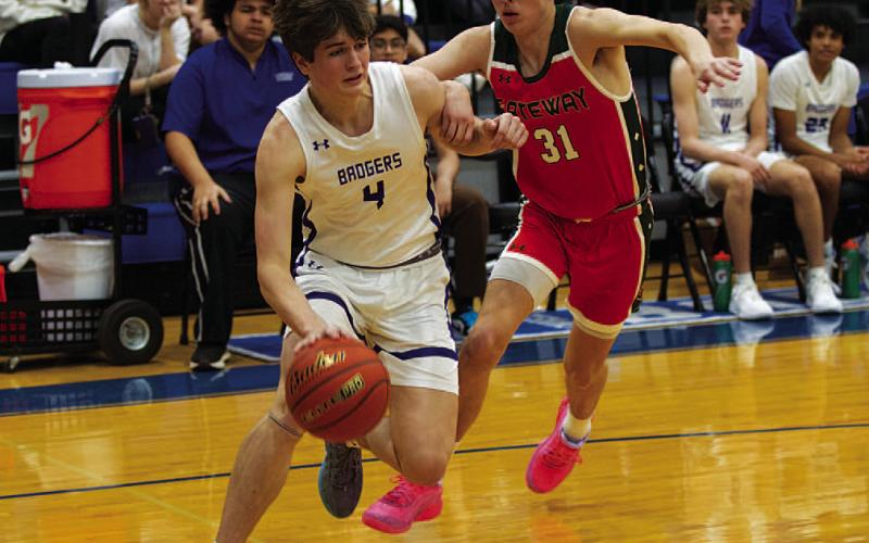 Calum Mitchell drives baseline against the Gateway Gators in the district opener. HUNTER KING | DISPATCH RECORD